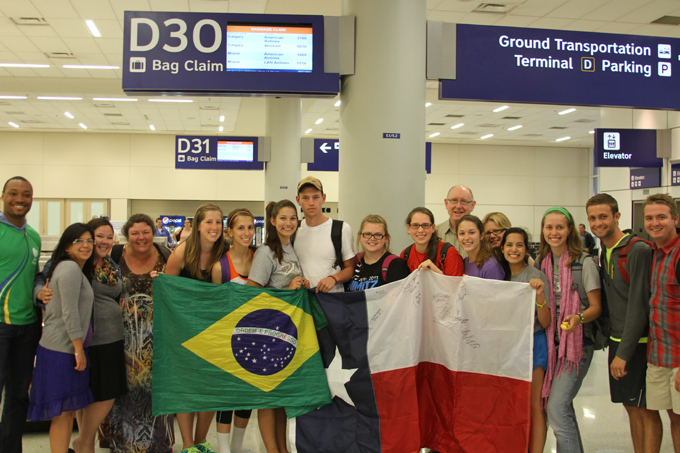 Dallas Catholics pose for a photo at D/FW Airport after arriving on August 1 from Rio de Janeiro, Brazil. (Seth Gonzales/Texas Catholic)