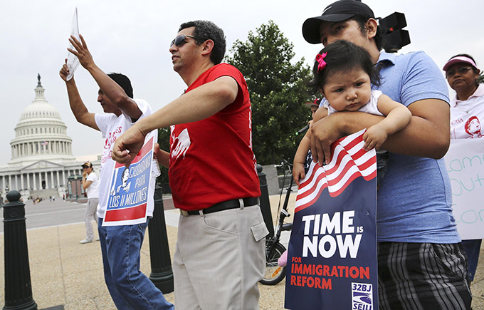 A group of immigrants and activists for immigration reform chant as they march on Capitol Hill in Washington. (CNS/Jonathan Ernst, Reuters)