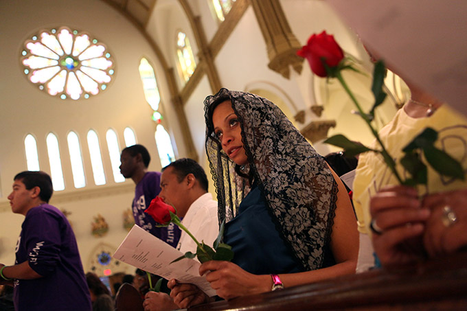 Pro life supporter Tiffany Oplacio kneels during communion of the pro life mass, on Jan. 19, 2013 at the Cathedral in Downtown Dallas. (Ben Torres/Special Contributor)