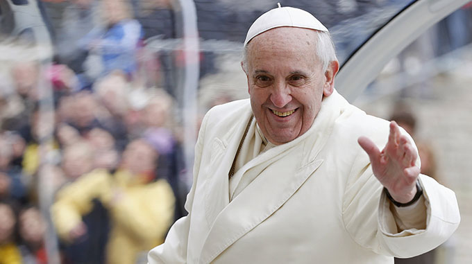 Pope Francis waves as he leaves his general audience in St. Peter's Square at the Vatican Jan. 29. (CNS photo/Tony Gentile, Reuters) (Jan. 29, 2014)
