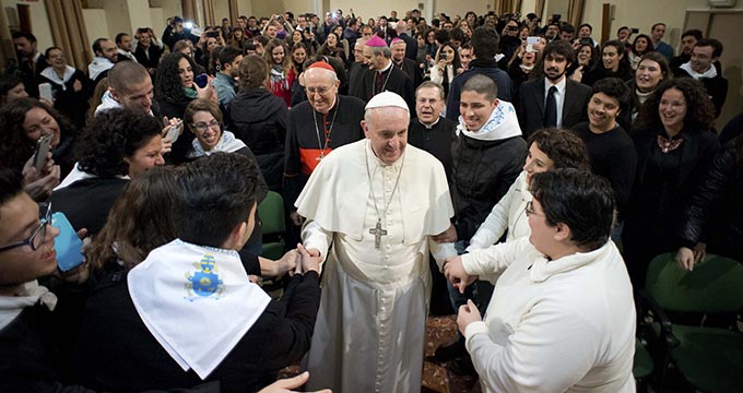 Pope Francis greets people at the Basilica of the Sacred Heart of Jesus in Rome