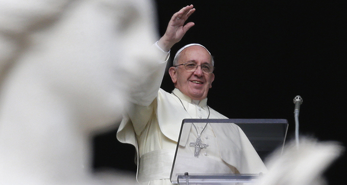 Pope Francis waves during Angelus at Vatican