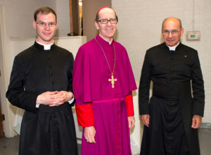 Phoenix Bishop Thomas J. Olsted, center, is seen with Fathers Kenneth Walker, left, and Joseph Terra, right, in a recent photo. The two priests of the Mater Miseidordiae (Mother of Mercy) Mission. On June 11 the priests were victims of a violent attack. Father Walker died of a gunshot wound. Father Terra June 12 was listed in critical but stable condition. (CNS photo/courtesy PhoenixLatinMass.com)