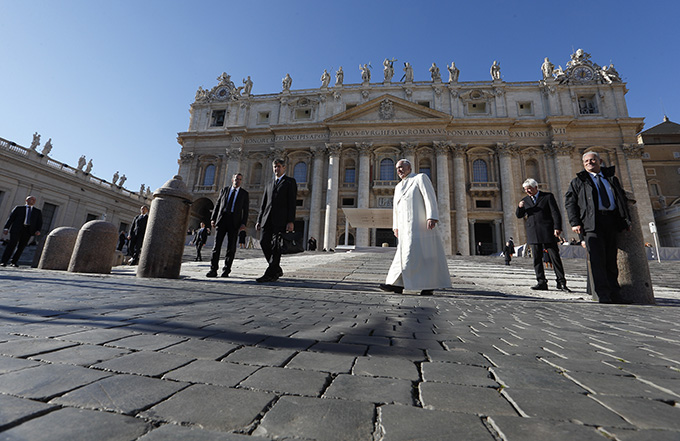 Pope Francis leaves his general audience in St. Peter's Square at the Vatican Dec. 10. (CNS photo/Paul Haring)