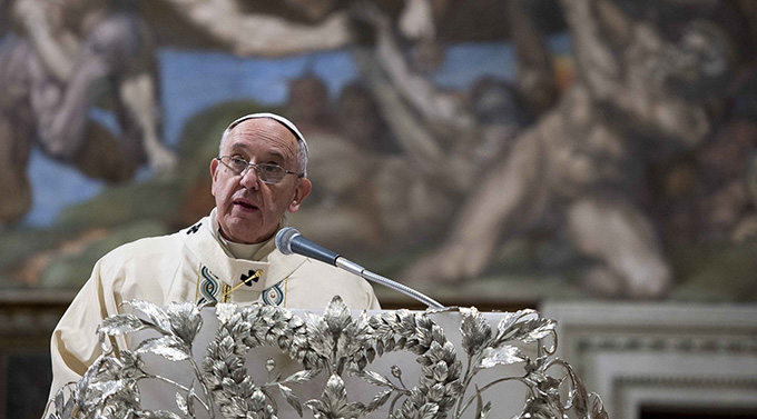 Pope Francis speaks as he celebrates Mass in the Sistine Chapel at the Vatican Jan. 11. Pope Francis baptized 33 infants during the Mass. (CNS photo/L'Osservatore Romano via Reuters)