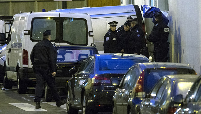 French police evacuate the bodies of the victims after a mass shooting at the Paris offices of Charlie Hebdo, a satirical newspaper, Jan. 7. Pope Francis condemned the killings of at least 12 people at the offices of the satirical newspaper Jan. 7 and denounced all "physical and moral" obstacles to the peaceful coexistence of nations, religions and cultures. (CNS photo/Etienne Laurent, EPA)