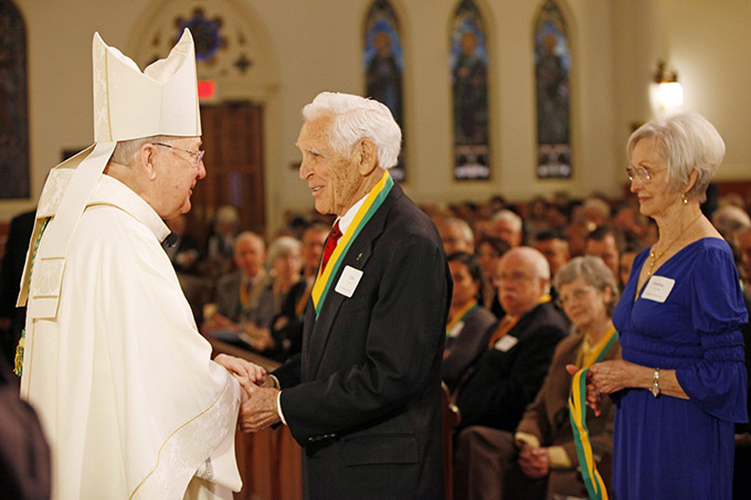 Bishop Kevin J. Farrell presents a Bishop Award for Service to the Church to Lee Cook, a parishioner at St. Elizabeth Ann Seton Catholic Church in Plano, during the Mass celebrating the Bishop’s Awards for Service to the Church, on Feb. 7 at the Cathedral Shrine of the Virgin of Guadalupe in downtown Dallas. (BEN TORRES/Special Contributor)