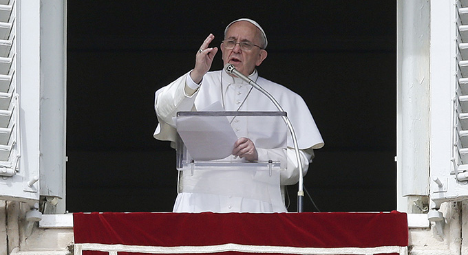 Pope Francis gives a blessing as he leads the Angelus from the window of the Apostolic Palace in St. Peter's Square at the Vatican Feb. 22. (CNS photo/Max Rossi, Reuters)