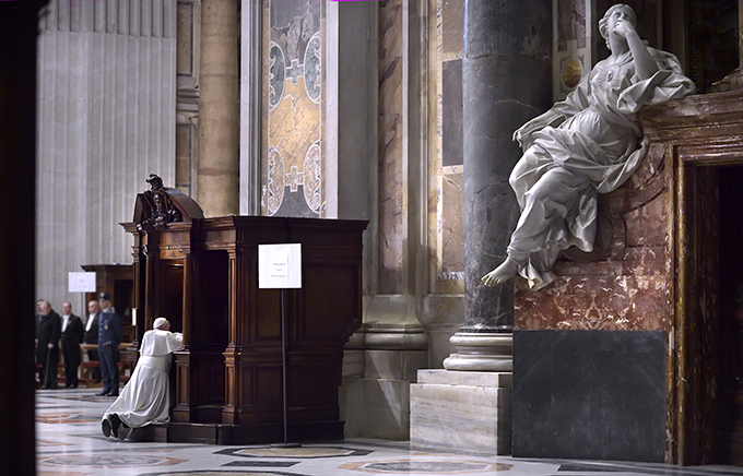 Pope Francis goes to confession during a Lenten penance service in St. Peter's Basilica at the Vatican March 13. (CNS photo/Stefano Spaziani)