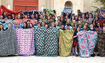 Students craft blankets for children in need