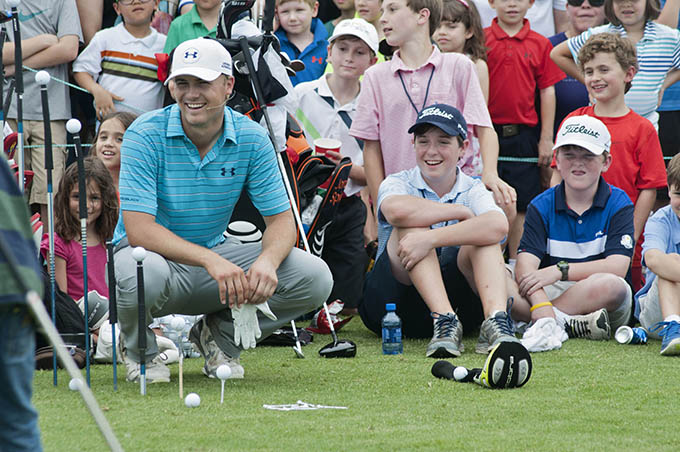 Dallas native and Jesuit alum Jordan Spieth hosts a free youth clinic alongside fellow PGA Tour player and Dallas native Harrison Frazer at the TPC Four Seasons golf course in Las Colinas May 26. (JENNA TETER/The Texas Catholic)