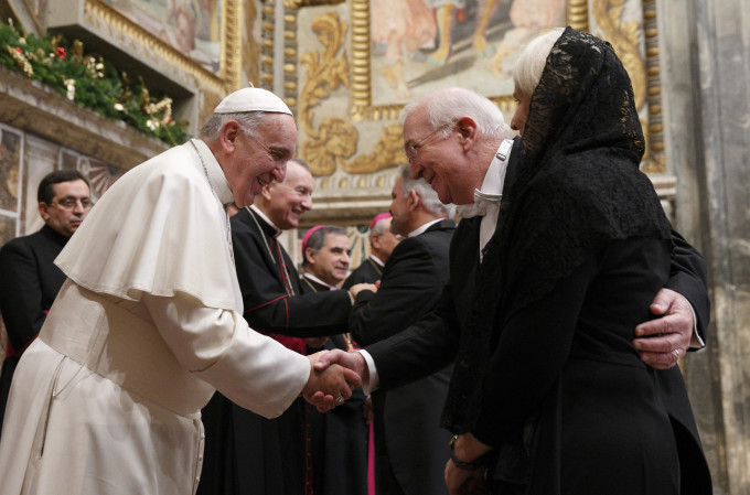 Pope Francis exchanges greetings with Ken Hackett, U.S. ambassador to the Holy See, and his wife, Joan, during a meeting with ambassadors to the Holy See at the Vatican Jan. 13. (CNS photo/Paul Haring)