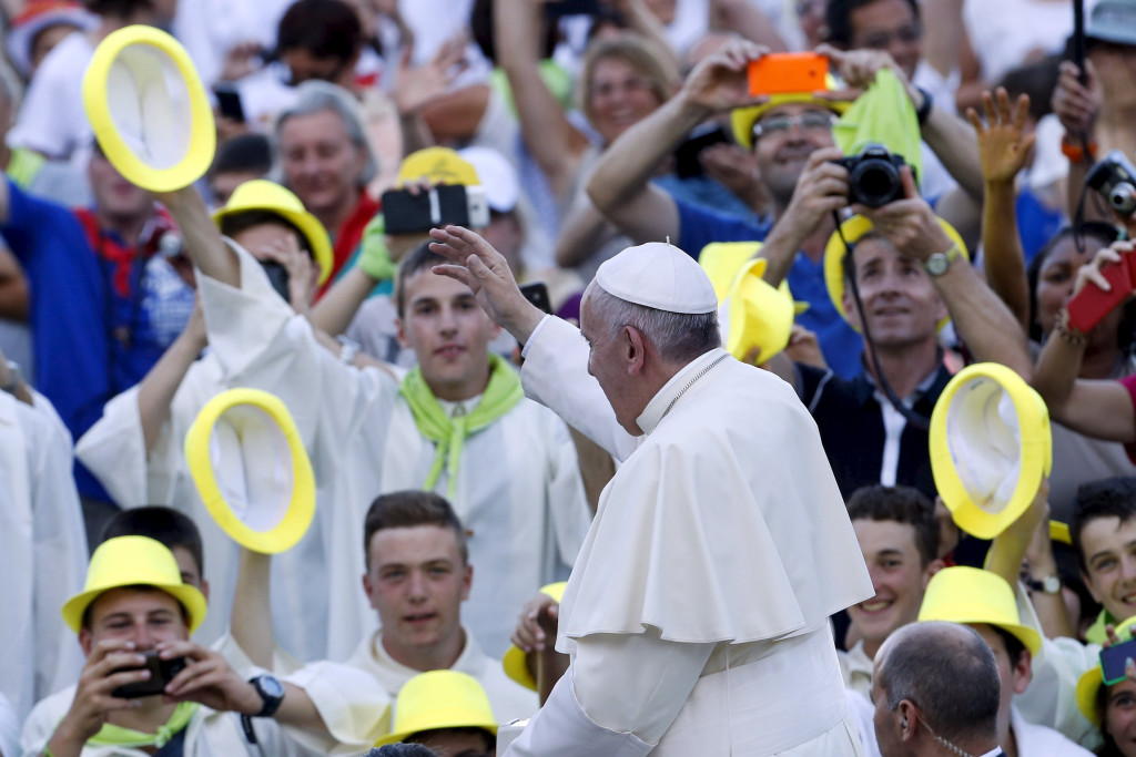 Pope Francis waves as he arrives to attend an audience with some 9,000 altar servers in St. Peter's Square at the Vatican Aug. 4. (CNS photo/Giampiero Sposito, Reuters)