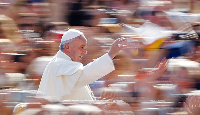 Pope Francis greets the crowd during his general audience in St. Peter's Square at the Vatican Sept. 9. (CNS photo/Paul Haring)