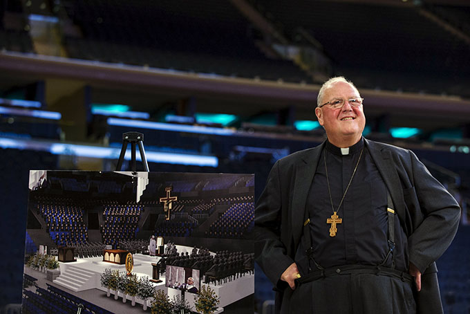Cardinal Timothy M. Dolan of New York smiles as he waits to speak Sept. 2 about the chair Pope Francis will use when he celebrates Mass in Madison Square Garden. The Mass is set for Sept. 25. (CNS photo/Lucas Jackson, Reuters)