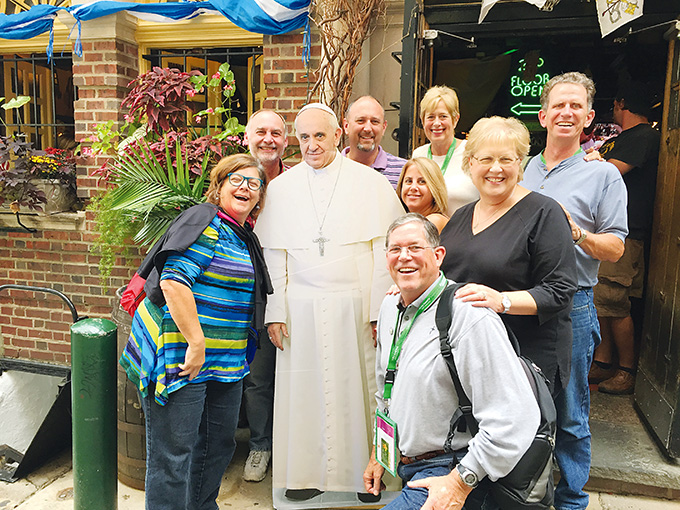 A group from St. Gabriel Catholic Church in McKinney poses with a life-size cutout of Pope Francis while visiting Philadelphia for the World Meeting of Families. (Photo by Deacon Mike Seibold)
