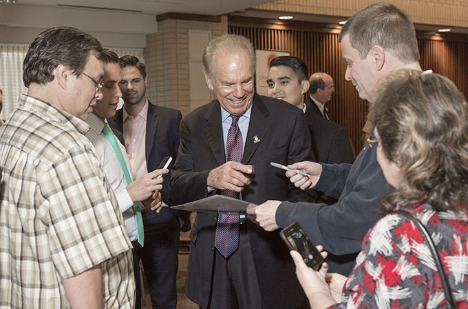 Roger Staubach is surrounded by people seeking autographs at the Archangels Men's Network breakfast at St. Paul the Apostle Catholic Church in Richardson, Friday, Oct. 9, 2015 (Ron Heflin/Special Contributor)