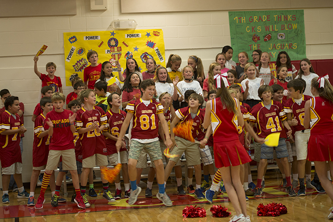Cheerleaders lead Christ the King Catholic School students in celebrating the announcement that the campus was recognized as a 2015 National Blue Ribbon School of Academic Excellence. (JENNA TETER/The Texas Catholic)