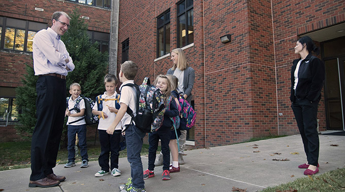 JENNA TETER/The Texas Catholic Matt Vereecke, who in January will step into the role of superintendent of Dallas Catholic Schools, visits with students outside of Monte Cassino School in Tulsa, Okla., on Nov. 3. Vereecke currently serves as the director of the Tulsa school, which is the largest Catholic elementary school in Oklahoma. (JENNA TETER/The Texas Catholic)