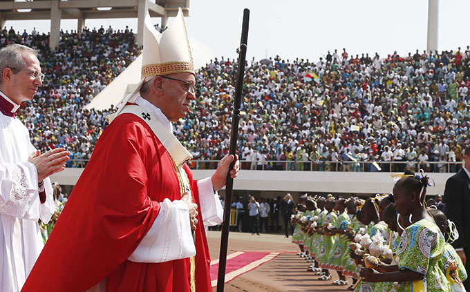 Pope Francis arrives in procession to celebrate Mass at Barthelemy Boganda Stadium in Bangui, Central African Republic, Nov. 30. (CNS photo/Paul Haring)