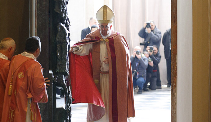 Pope Francis opens the Holy Door of the Basilica of St. John Lateran in Rome Dec. 13. Holy doors around the world were opened at city cathedrals, major churches and sanctuaries Dec. 13 as part of the Jubilee of Mercy. (CNS photo/Paul Haring)