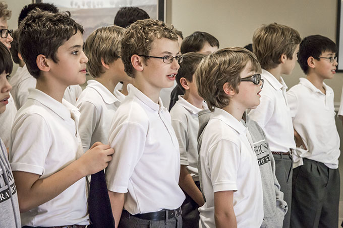 Fifth-grade students from Cistercian Preparatory School sing Christmas carols at the Northgate Plaza nursing home in Irving on Dec. 11. (RON HEFLIN/Special Contributor)