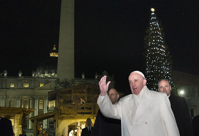 Pope Francis greets the crowd in St. Peter's Square after visiting the Nativity scene in the square on New Year's Eve at the Vatican Dec. 31. (CNS photo/Paul Haring)