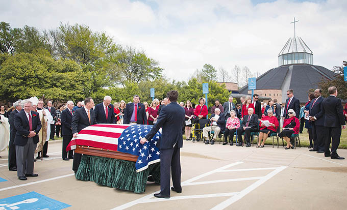 An American flag is draped over the casket of Msgr. Jim Balint, who served in the U.S. Air Force prior to being ordained as a priest in 1961, following the funeral Mass on March 29 at Prince of Peace Catholic Church in Plano. (RON HEFLIN/Special Contributor)