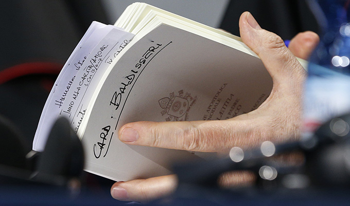 Cardinal Lorenzo Baldisseri, general secretary of the Synod of Bishops, holds his copy of Pope Francis' apostolic exhortation on the family, "Amoris Laetitia" ("The Joy of Love"), during a news conference for the release of the document at the Vatican April 8. The exhortation is the concluding document of the 2014 and 2015 synods of bishops on the family. (CNS photo/Paul Haring)