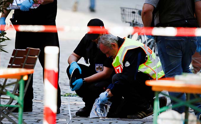 German police secure the area after a 27-year-old Syrian detonated a homemade bomb in Ansbach July 25. (CNS photo/Michaela Rehle, Reuters)