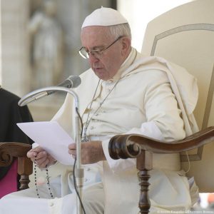 Pope Francis is seen holding his rosary during his general audience in St. Peter's Square at the Vatican Aug. 24. Pope Francis put aside his prepared remarks and led a recitation of the rosary for Italy's earthquake victims. (CNS photo/L'Osservatore Romano via EPA)