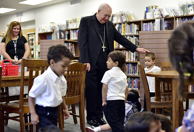 Bishop Kevin J. Farrell visits students at St. Philip & St. Augustine Catholic Academy on their first day of school on Aug. 12. (BEN TORRES/Special Contributor)
