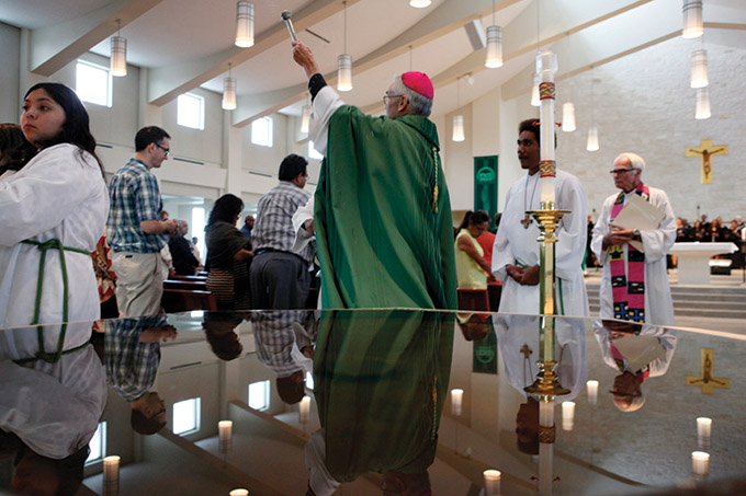 Father Timothy Gollob, far right, watches as Bishop Greg Kelly conducts a special blessing during a Mass celebrating the life and legacy of Sister Thea Bowman, on Saturday, Oct. 16, 2016 at Holy Cross Catholic Church in Dallas. (Ben Torres/Special Contributor)