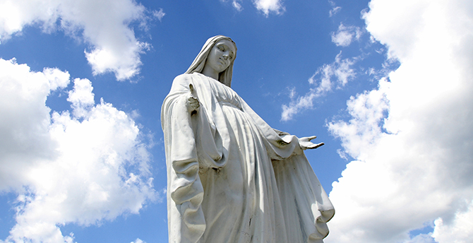 A statue of Mary overlooks the grounds of St. Jude Church in Mastic Beach, N.Y., Aug. 4. (CNS photo/Gregory A. Shemitz)