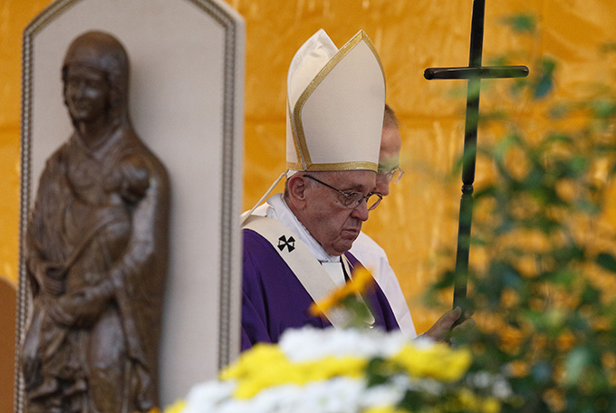 Pope Francis leaves after celebrating Mass in Rome's Prima Porta cemetery Nov. 2, the feast of All Souls. (CNS photo/Paul Haring)