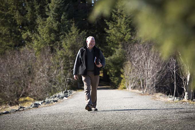 Bishop Edward J. Burns of Juneau, Alaska, walks outside of the Shrine of St. Therese in Juneau in this 2014 photo. (CNS photo/Nancy Wiechec)