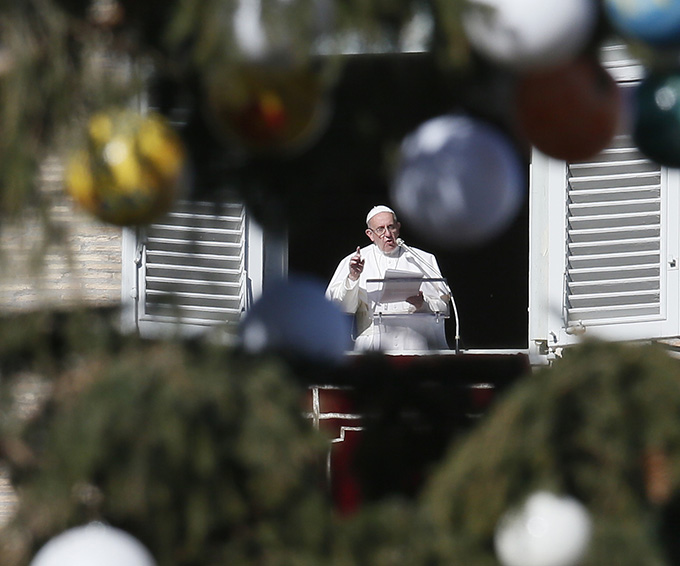 Pope Francis leads the Angelus from his studio overlooking St. Peter's Square at the Vatican Jan. 6, the feast of the Epiphany. (CNS photo/Paul Haring)