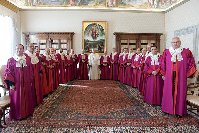 Pope Francis poses with members of the Roman Rota during a meeting inaugurating the judicial year of the Roman Rota at the Vatican Jan. 21. The Roman Rota is the highest appellate court in the Catholic Church; it mainly handles marriage cases. (CNS photo L'Osservatore Romano, handout)