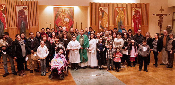 Father Michael Galbraith with the Hispanic Ministry group at St. Paul Catholic Church in Juneau, Alaska on Jan. 22. (JENNA TETER/The Texas Catholic)