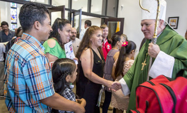 Bishop helps parish, school mark pair of milestones