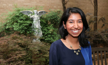 Bishop Dunne grad returns to help students get college ready