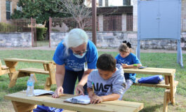 Studying, feeding a goat, petting a horse all part of school day