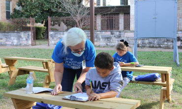 Studying, feeding a goat, petting a horse all part of school day