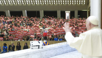 A better world can't be built 'lying on the couch,' pope tells children